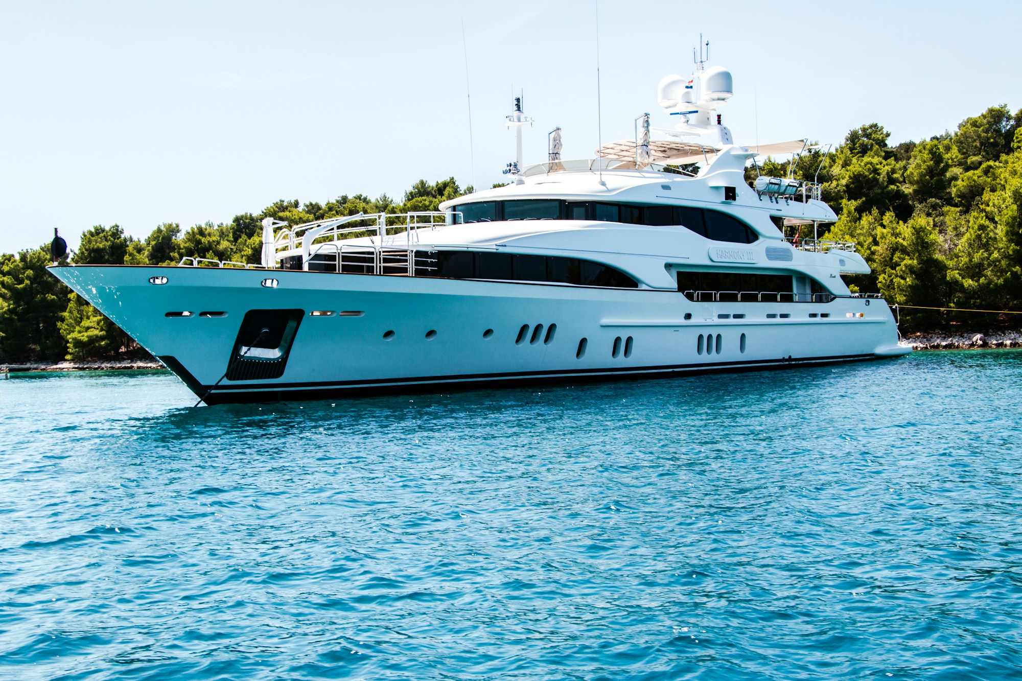 Motor yacht anchored in clear Mediterranean water